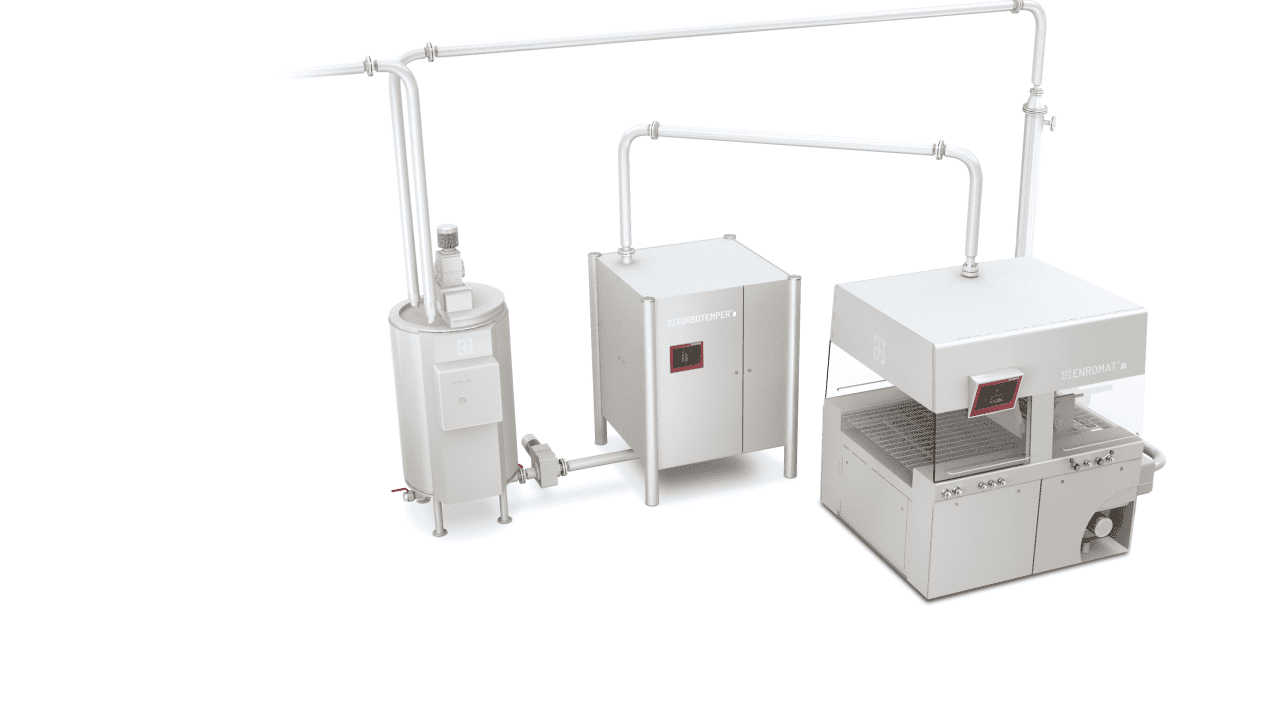 Feeding a chocolate enrober via the SOLLICH circulation tempering process with the tempering machine Turbotemper®e (in the center of the picture)