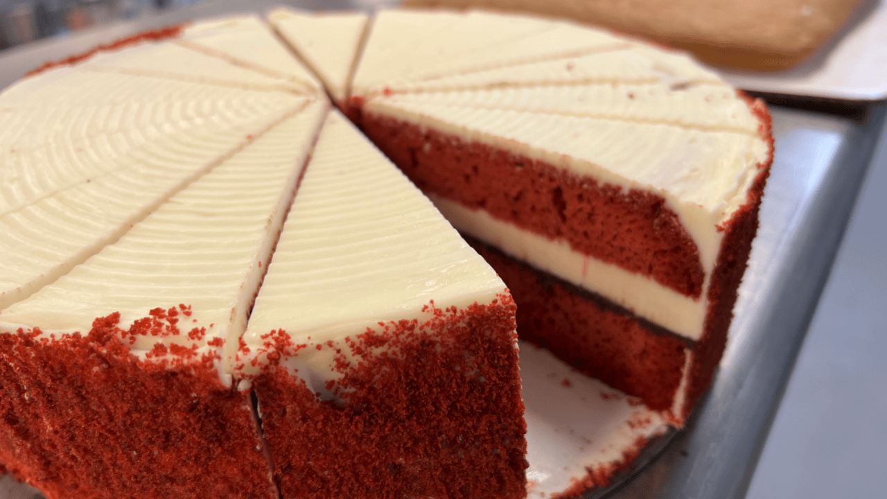 Cutting red velvet cake