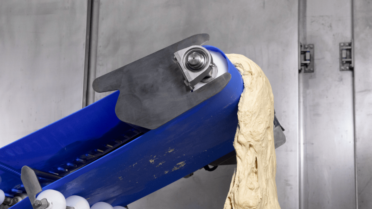 Matte finish belt surface for clean, easy dough release