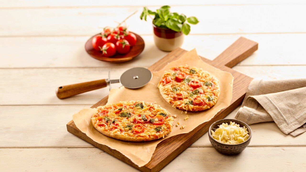 Vegan pizza snack Margherita with basil-topping