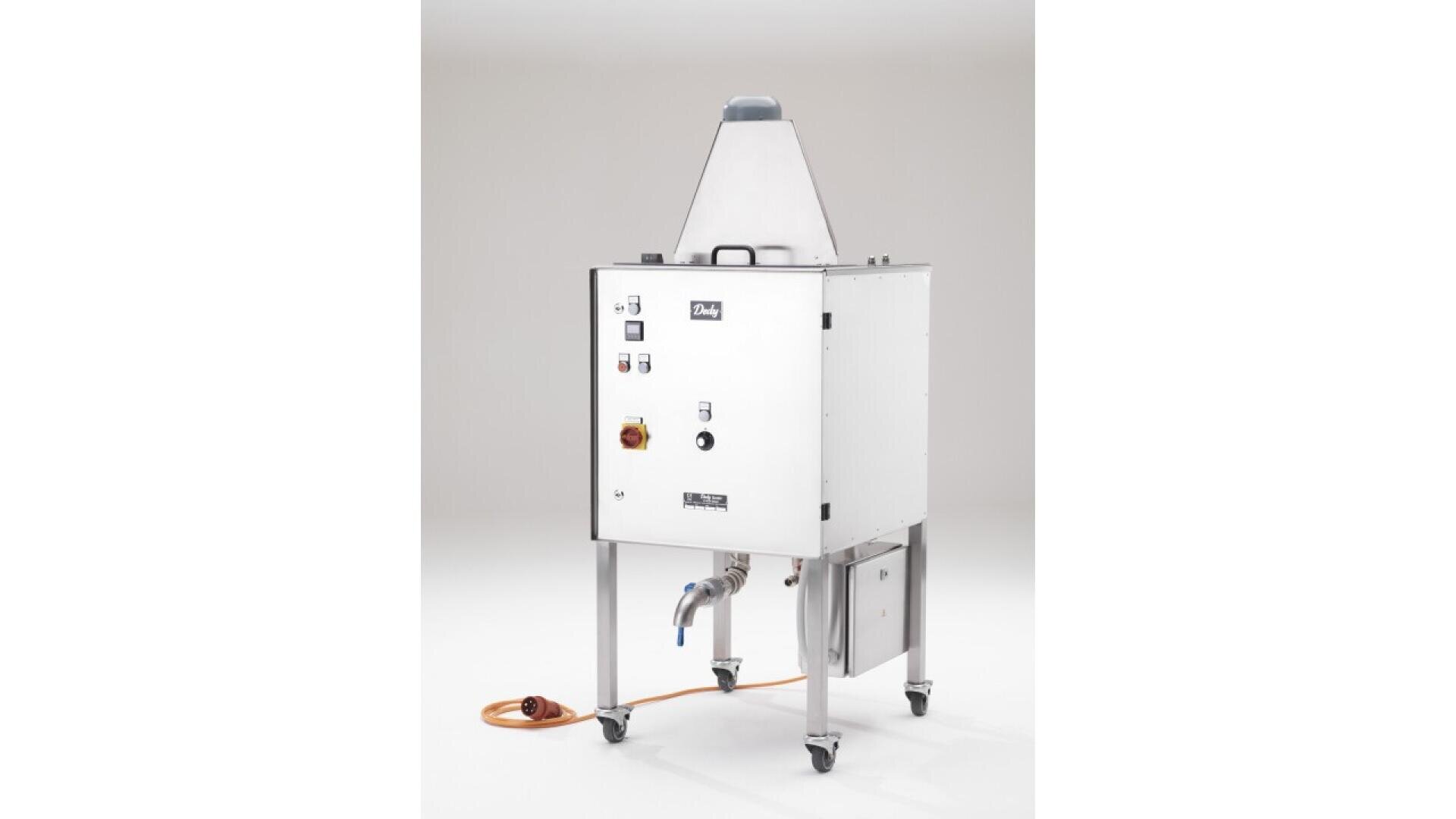 A stainless steel industrial machine on wheels with a cone-shaped top, control panel, hose, and various pipes, set against a plain white background.