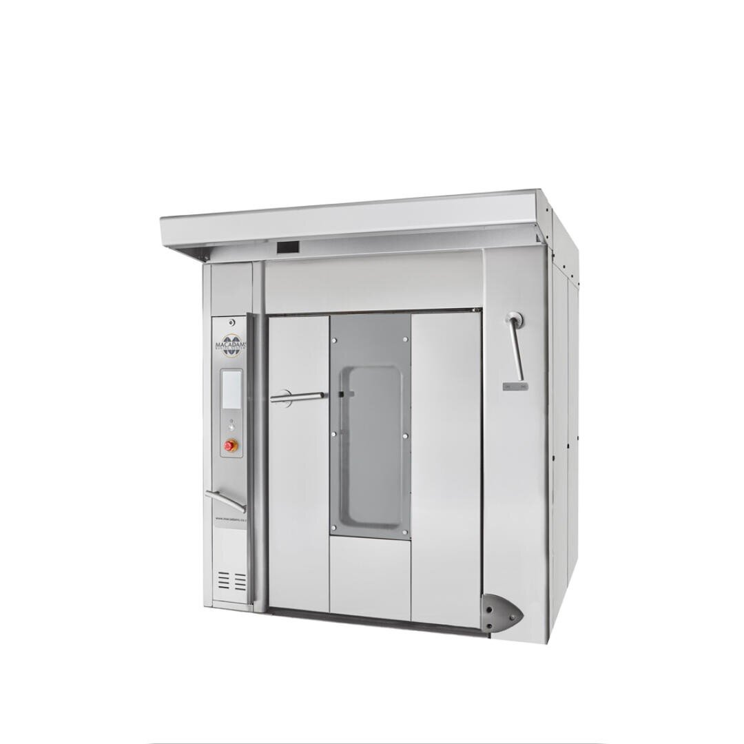 A large industrial oven made of stainless steel with a glass window in the middle of the door, a control panel on the left and a handle on the right, against a plain white background.