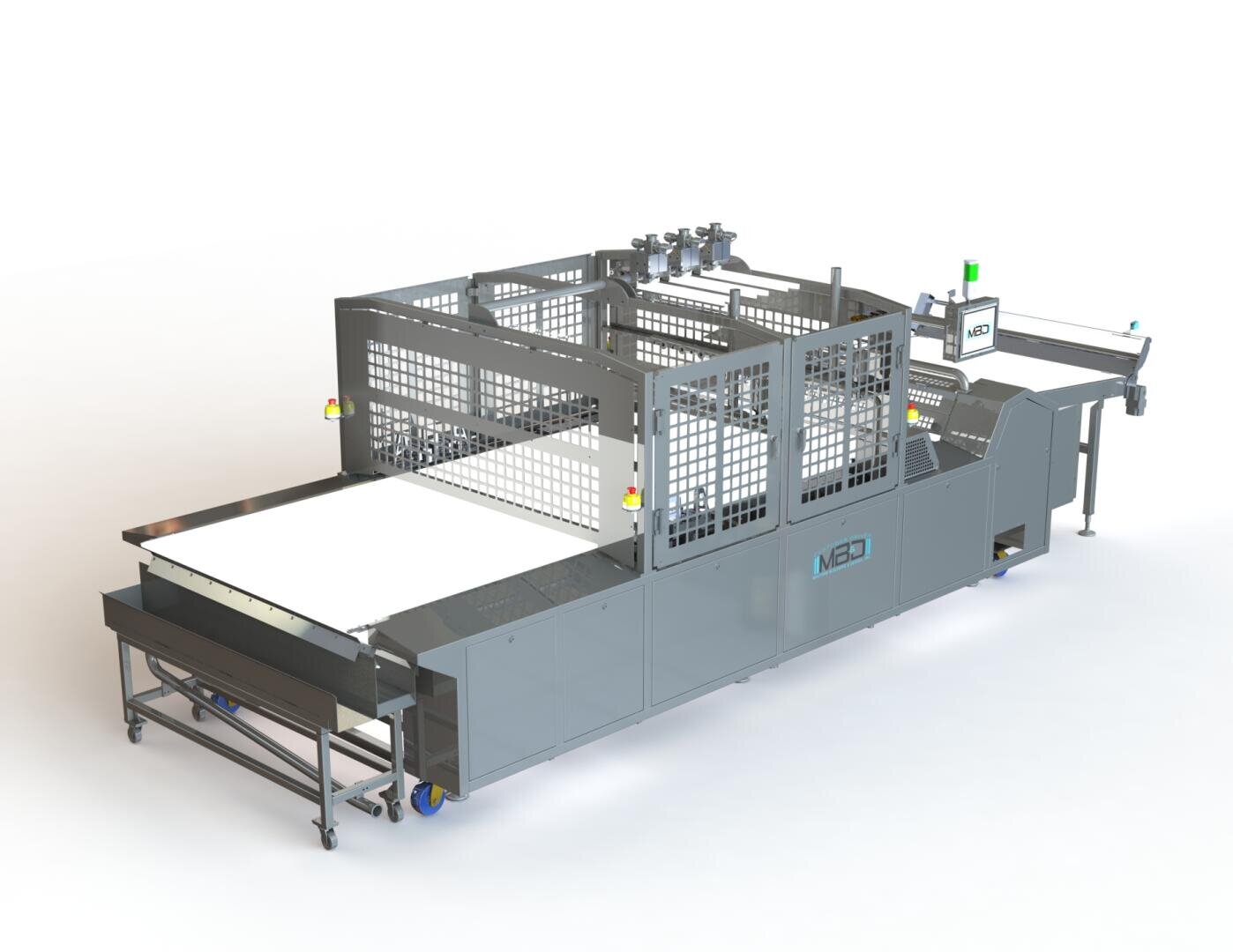 A large industrial machine with metal framework, safety guards, conveyor belts, and a control panel, designed for automated processing or packaging in a manufacturing facility.