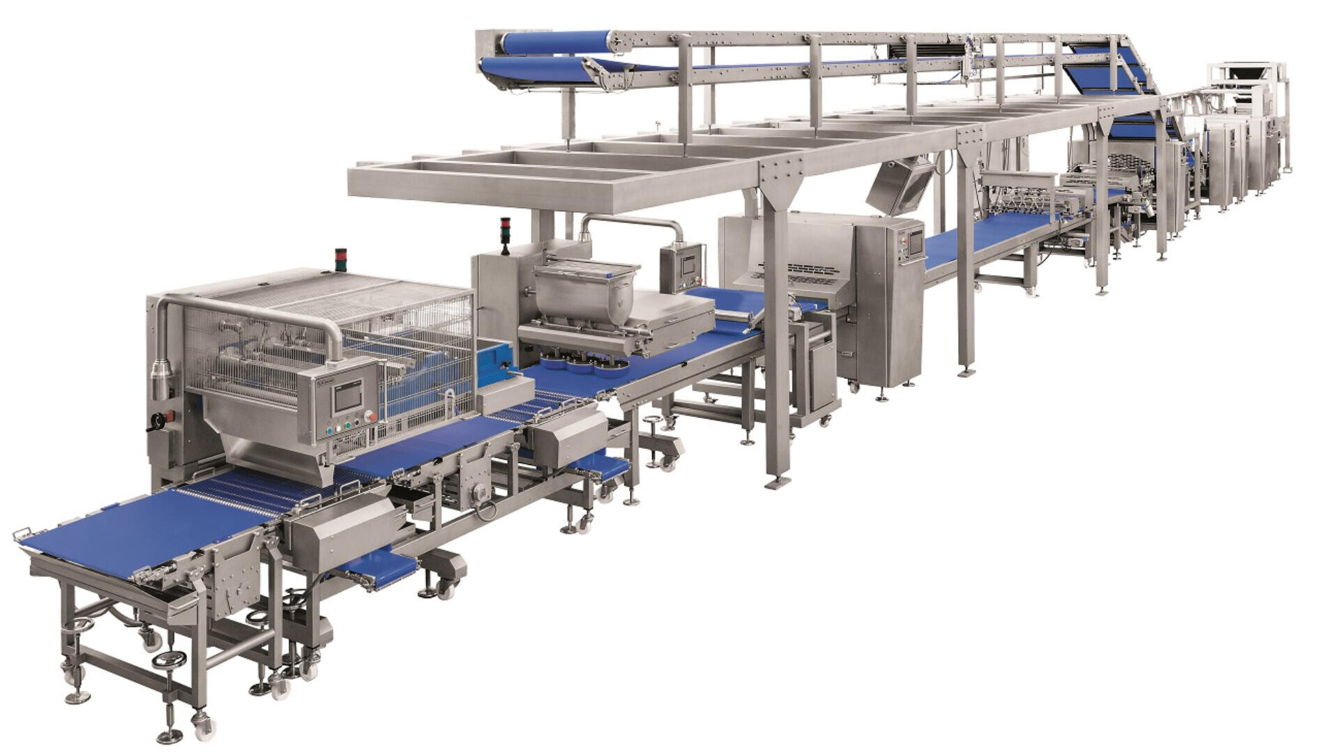 A large industrial food processing machine with multiple blue conveyor belts, stainless steel components, and various enclosed sections for automated production in a factory setting.
